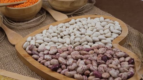 Assorted Legumes and Grains in Wooden Bowls