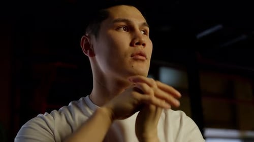 Thoughtful Gym Goer in Workout Break