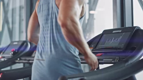 Man Working Out on Treadmill at the Gym