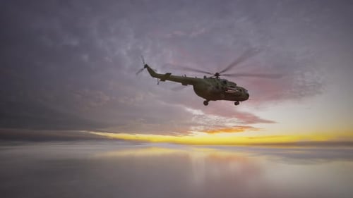 Military Helicopter Flight Over Reflective Sky at Golden Sunset
