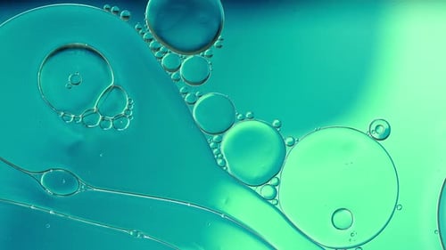 Abstract Macro of Teal Liquid Orbs