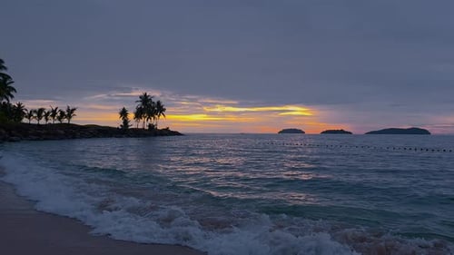 Tropical Beach At Sunset In Kota Kinabalu, Sabah, Malaysia. - wide shot
