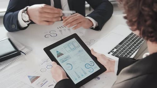 Business Analysis With Charts and Graphs on Tablet