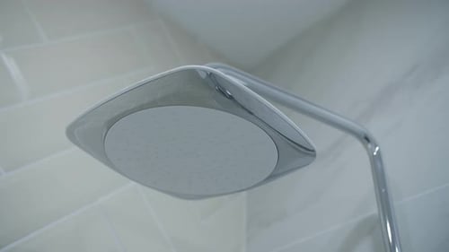 Shower in the Bathroom in the Apartment