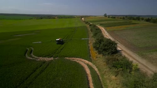 Spray Fertilize On Field With Chemicals In Agriculture Field