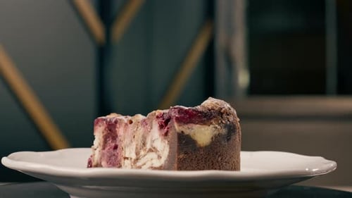 A dessert close-up of a piece of delicious cake lying on a white plate in an Italian restaurant