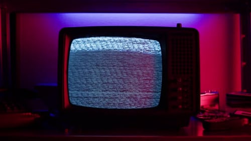 Vintage Television Displays Static with Red and Blue Lights