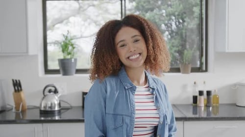 Woman Smiling in Bright Modern Kitchen