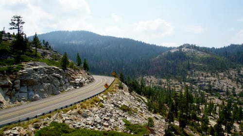 Highway Through a Mountain Forest by Aerial Drone Adventure