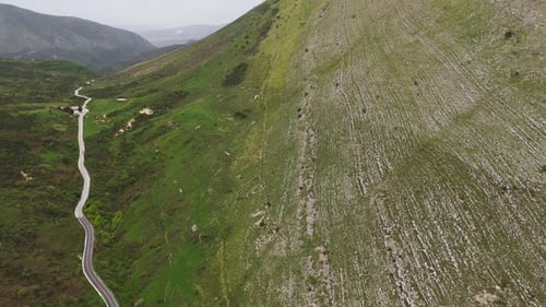 Aerial Drone View of Serene Mountain Landscape in Albania with Winding Road
