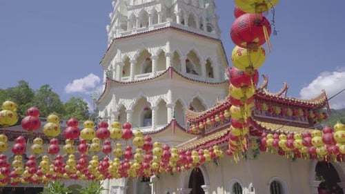 Pagoda in Kek Lok Si temple with Chinese lanterns in Air Itam, tilt up