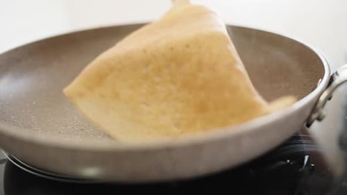 Cooking Pancakes in Pan with Spatula