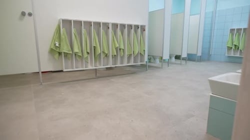 Sterile Bathroom with Green Towels