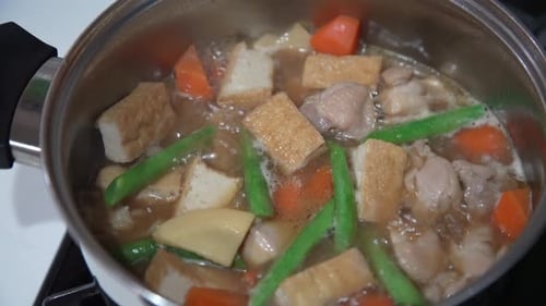 Simmering Chicken and Vegetable Stew in Pot