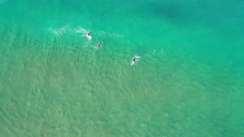 Surfers Enjoying Waves From Above, Aerial View
