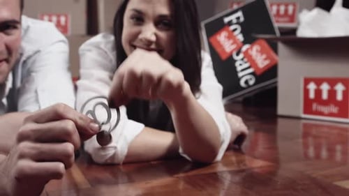 Couple Celebrates New Home Purchase with Keys