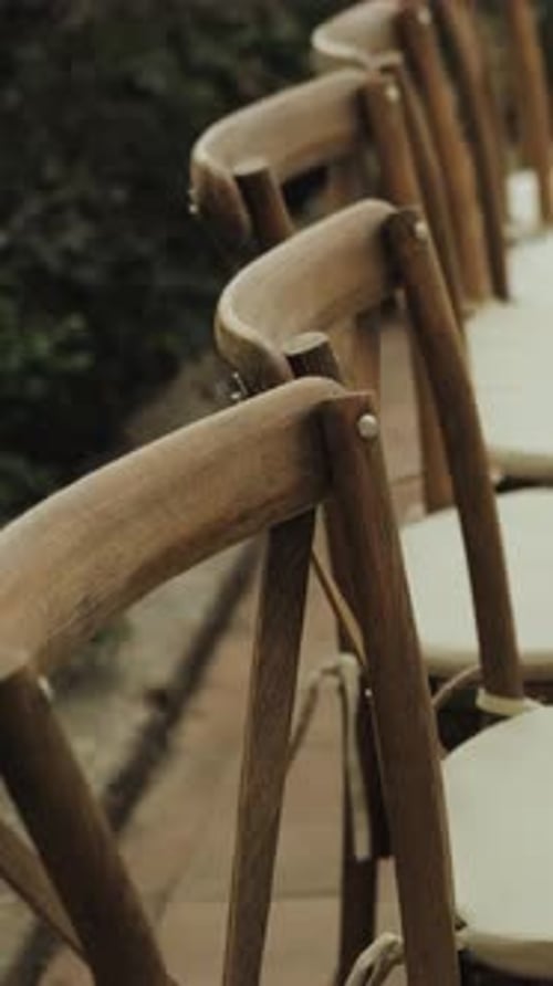 Elegant Rustic Chairs Ready for an Outdoor Wedding
