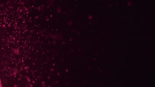 Dust falling in purple light.