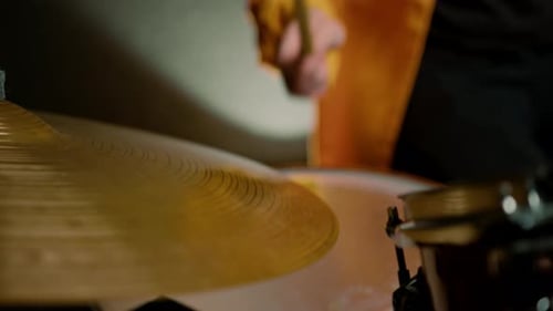 drummer plays a drum kit in a recording studio at a professional musician rehearsal recording a song