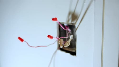 Electrical Outlet and Wires Inside a Wall Box During Home Renovation