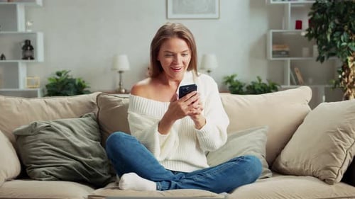 Woman Receives Good News on Mobile Phone
