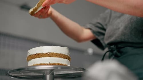 Icing Being Layered on Cake