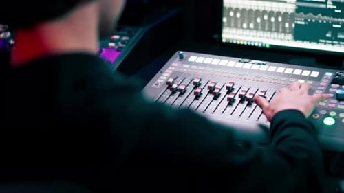 Close Up in the Recording Room Dark with Neon Lighting in the Studio the Sound Engineer Works at the