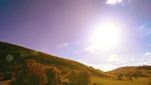 UHD Mountain Meadow Timelapse at the Summer Clouds Trees Green Grass and Sun Rays Movement