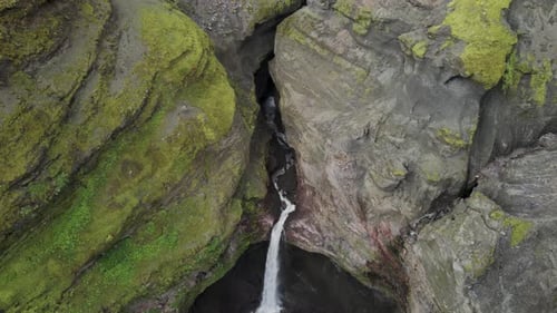 Aerial view of a stream of water in Mulagljufur Canyon, Iceland.