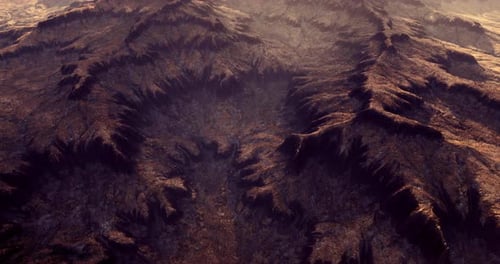 Expansive Mountain Landscape Showcasing Rugged Terrain Under Soft Sunlight