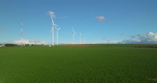 Renewable Energy Source Aerial View of Wind Turbines Standing on the Green Field Aerial View of a