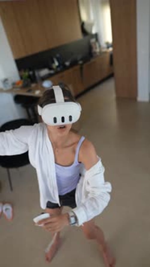 Woman with VR Headset Gaming at Home