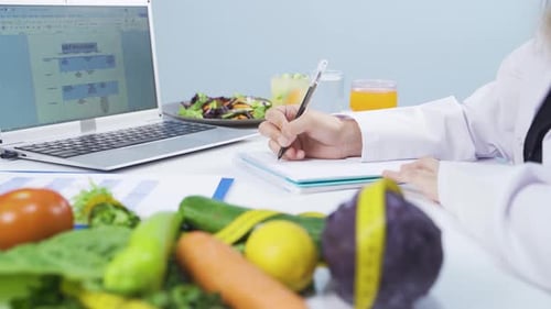 Dietitian working on diet plan.