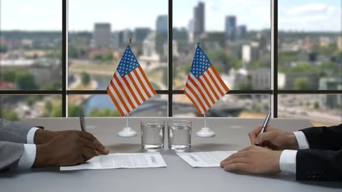 Businessmen Signing Contracts and Shaking Hands