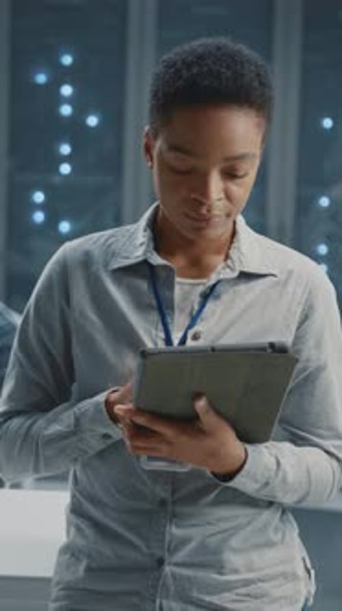 Woman Uses Tablet in Data Center Environment