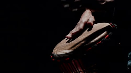 Hands Play Djembe Drum In The Dark
