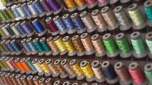 Close Up Shot Of Cotton Thread Spools In Various Colours And Shades.