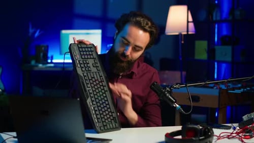 Man Reviewing Tech Gadgets for Podcast