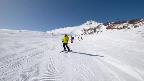 People Skiing On Snowy Mountain