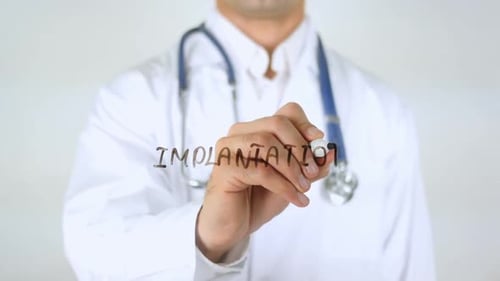 Implantation Doctor Writing on Glass