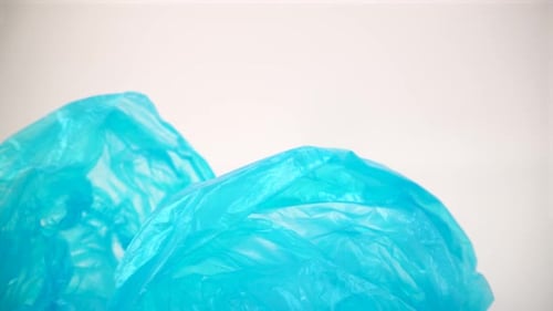 Close Up View of Two Abstract Teal Plastic Bags