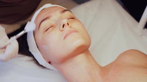 Woman Receiving Facial Treatment in Medical Spa