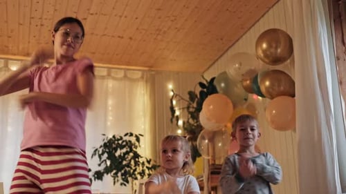 Children Dancing and Celebrating at Home Birthday Party