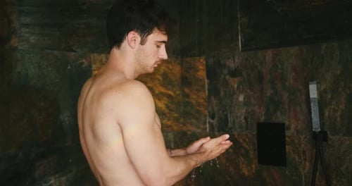 Young Man Washing in Modern Shower