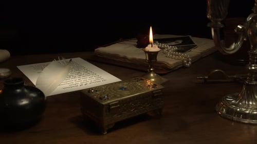 Vintage Desk with Antique Items and Candle