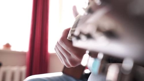Man Playing Acoustic Guitar Close Up Indoors