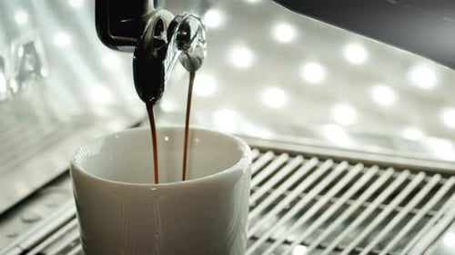 Espresso Pours From Machine Into Cup