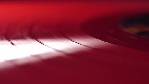 Red Vinyl Record Spinning on Gramophone Turntable, Close Up