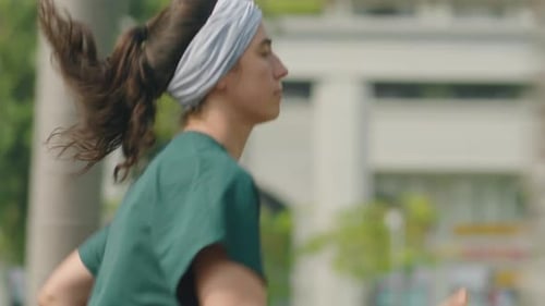 Woman Jogging in City