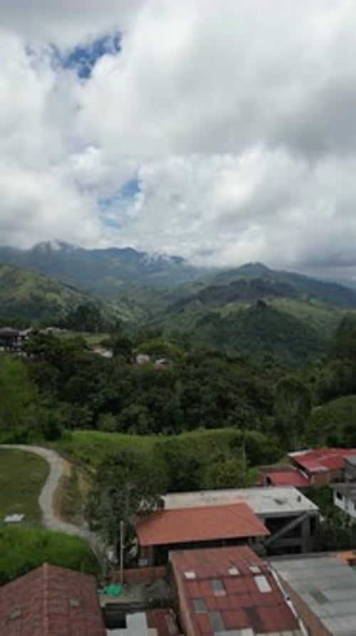 Aerial video over Salento towards a lush forested valley in the mountains of Colombia, Colombia